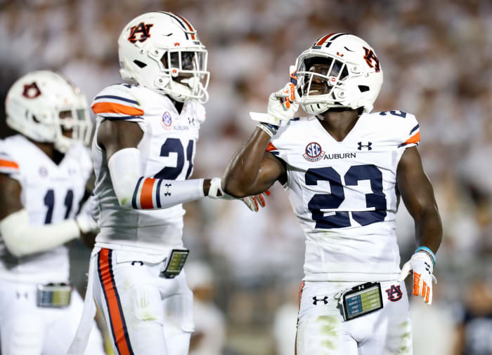 Sep 18, 2021; University Park, Pennsylvania, USA; Penn State Nittany Lions cornerback Roger McCreary (23) reacts towards the fans after intercepting the ball during the second quarter against the Auburn Tigers at Beaver Stadium. Mandatory Credit: Matthew OHaren-USA TODAY Sports